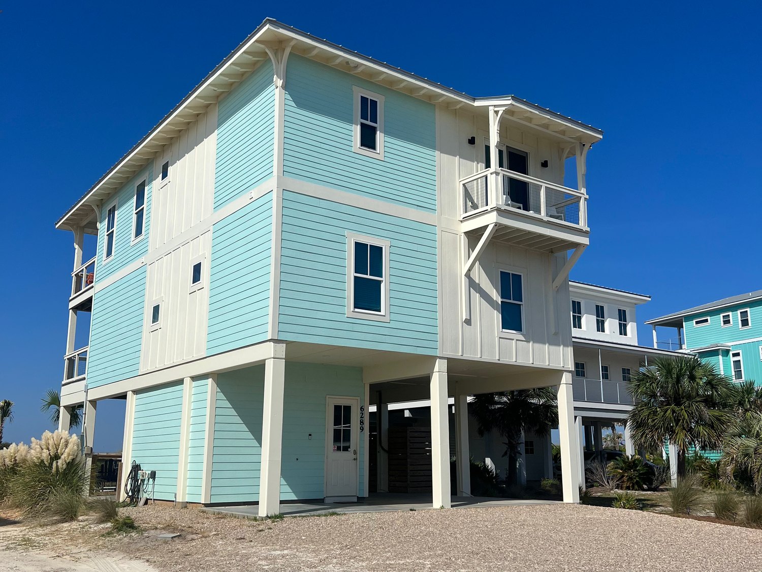 Blue elevated beach house in Florida